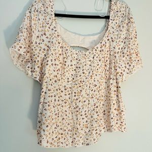Women’s cute shirt, with subtle cheetah print design and an open circle back!